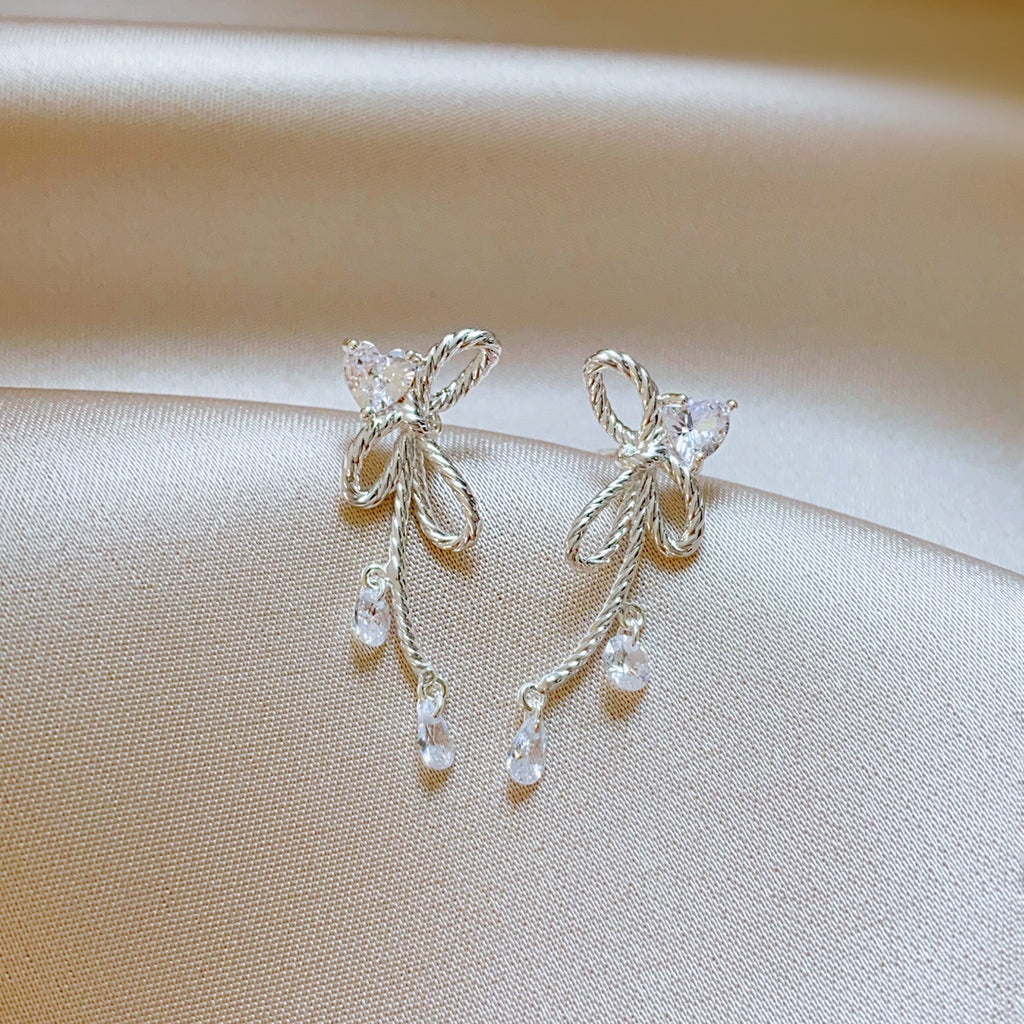 Silver Twisted Bow Zircon Tassel Earrings