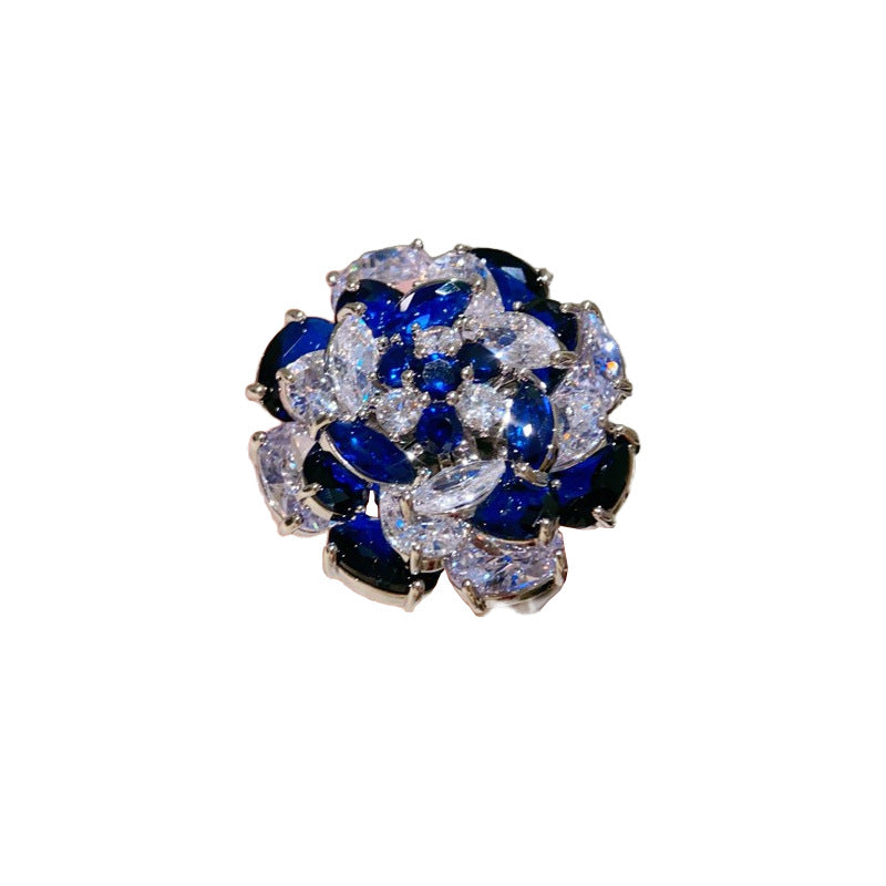 Rotating Sapphire Flower Ring – Adjustable Open Band with Blue Zirconia