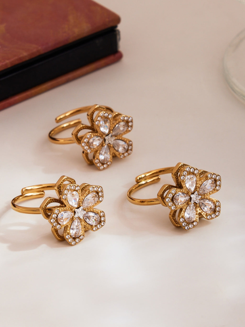 The Rotating Bloom Trio - Kinetic Five-Petal Flower Set in Stainless Steel & Zircon