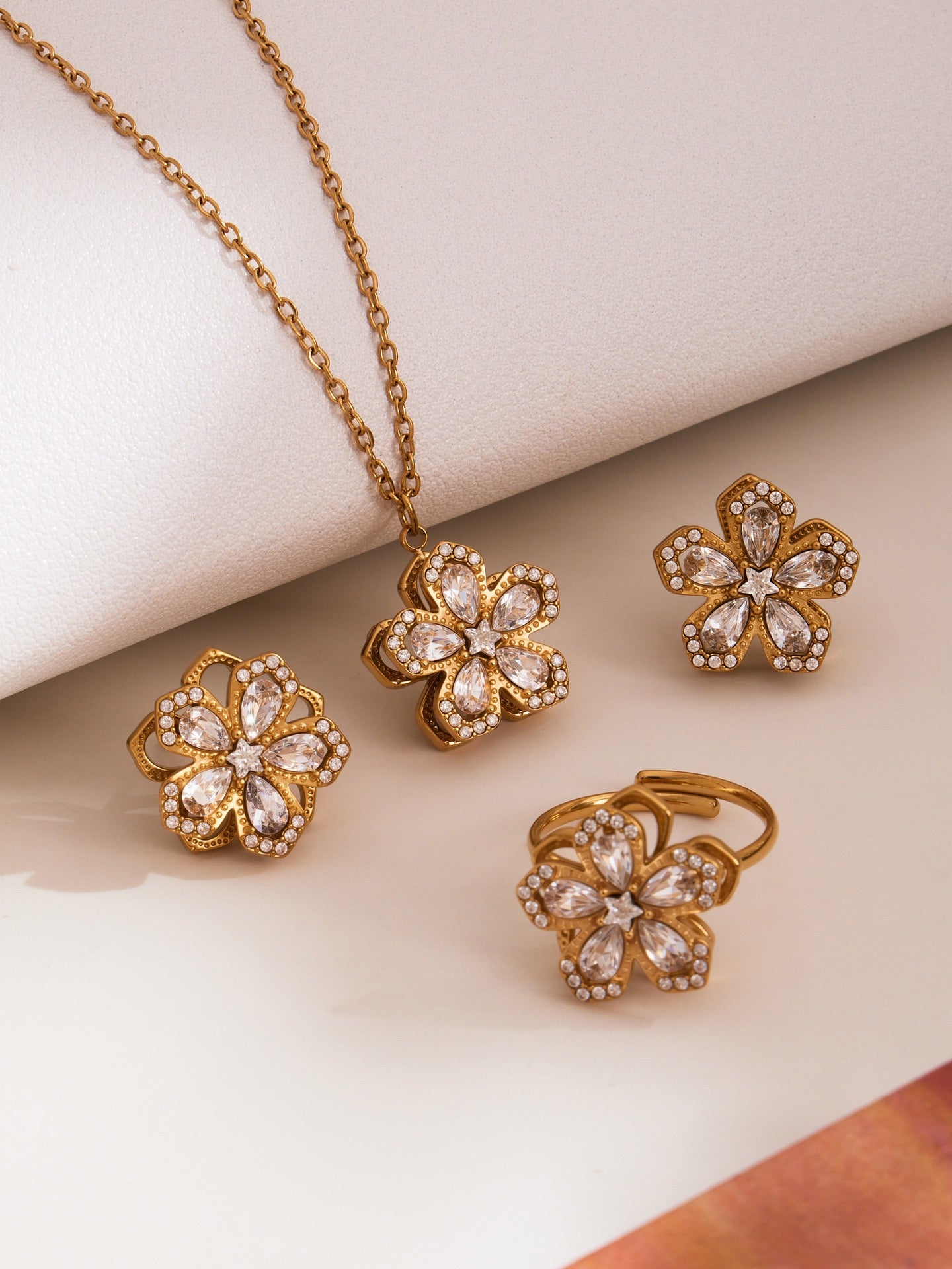 The Rotating Bloom Trio - Kinetic Five-Petal Flower Set in Stainless Steel & Zircon